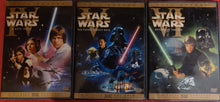 Load image into Gallery viewer, Front covers of three Star Wars full screen DVDs
